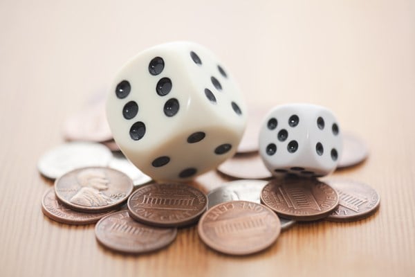 dice on top of coins