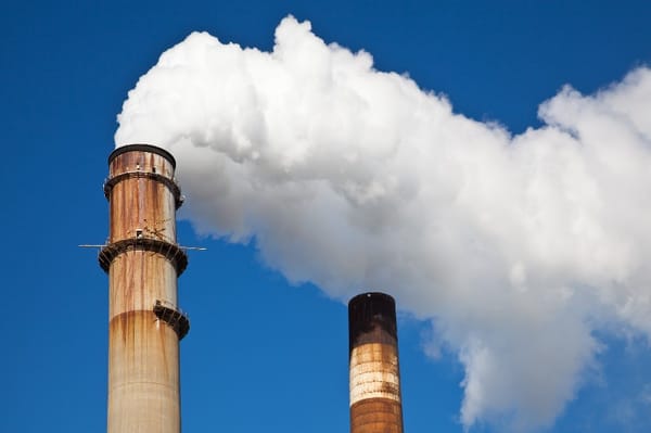 Factory with smoke coming out of stacks