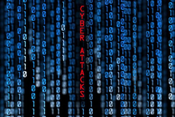 Strings of vertical binary code with words cyber attacks in
               red