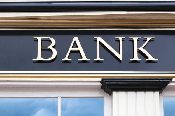 Globe on top of financial charts and graphs