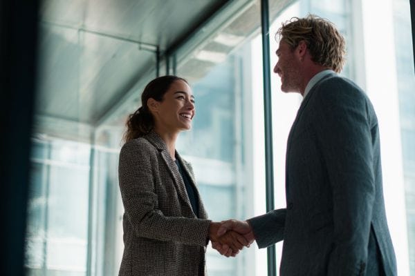 two insurance executives shaking hands