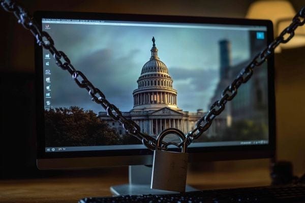 chain and padlock on top of a computer monitor showing the Minnesota capitol building