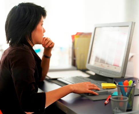 Woman focused on computer